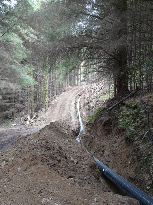Pipeline reaches the forest track where it will be buried in the uphill bank 15 July 2015