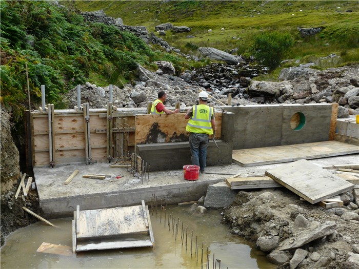 The shuttering is removed to reveal the weir structure 13 Aug 2015