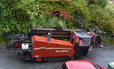 Scottish Powers drilling rig the Ditch Witch is tracked up through the village 2 Sept 2015
