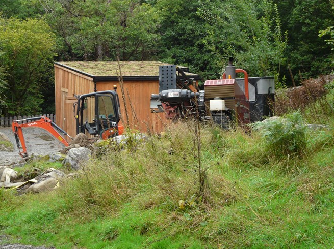 The Ditch Witch is positioned behind the turbine house 2 Sept 2015